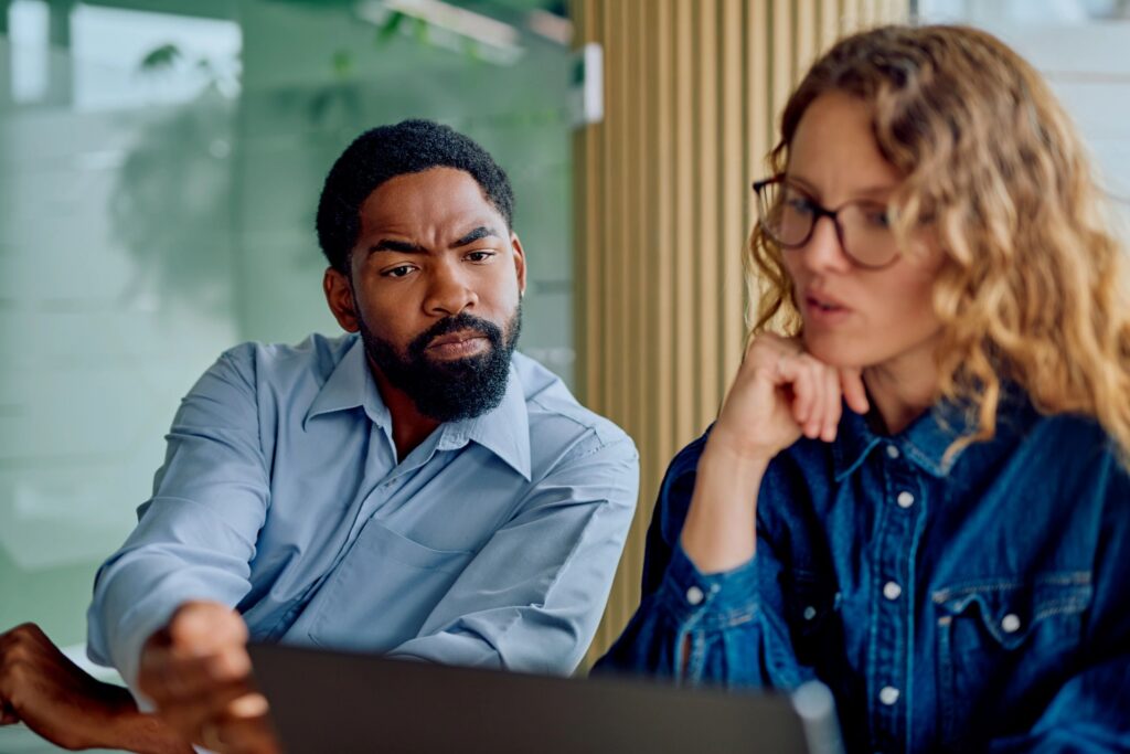 Diverse colleagues collaborating on project in office meeting